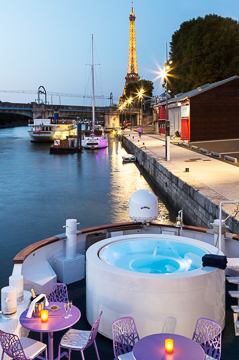 View across the bow of the Raymond in Paris at night. travel photography workshops, digital photography, landscapes, street photography, photo workshops, travel photography, travel adventures, Barefoot Contessa Photo Adventures